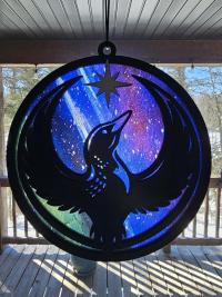Minnesota Resistance Loon, Minnesota artist, suncatcher, translucent, northern lights. Made by Betsy Skagen of Blue Waters Studio & Emporium. Made in Minnesota.