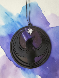 Minnesota Resistance Loon, Minnesota artist, suncatcher, translucent, northern lights. Made by Betsy Skagen of Blue Waters Studio & Emporium. Made in Minnesota.