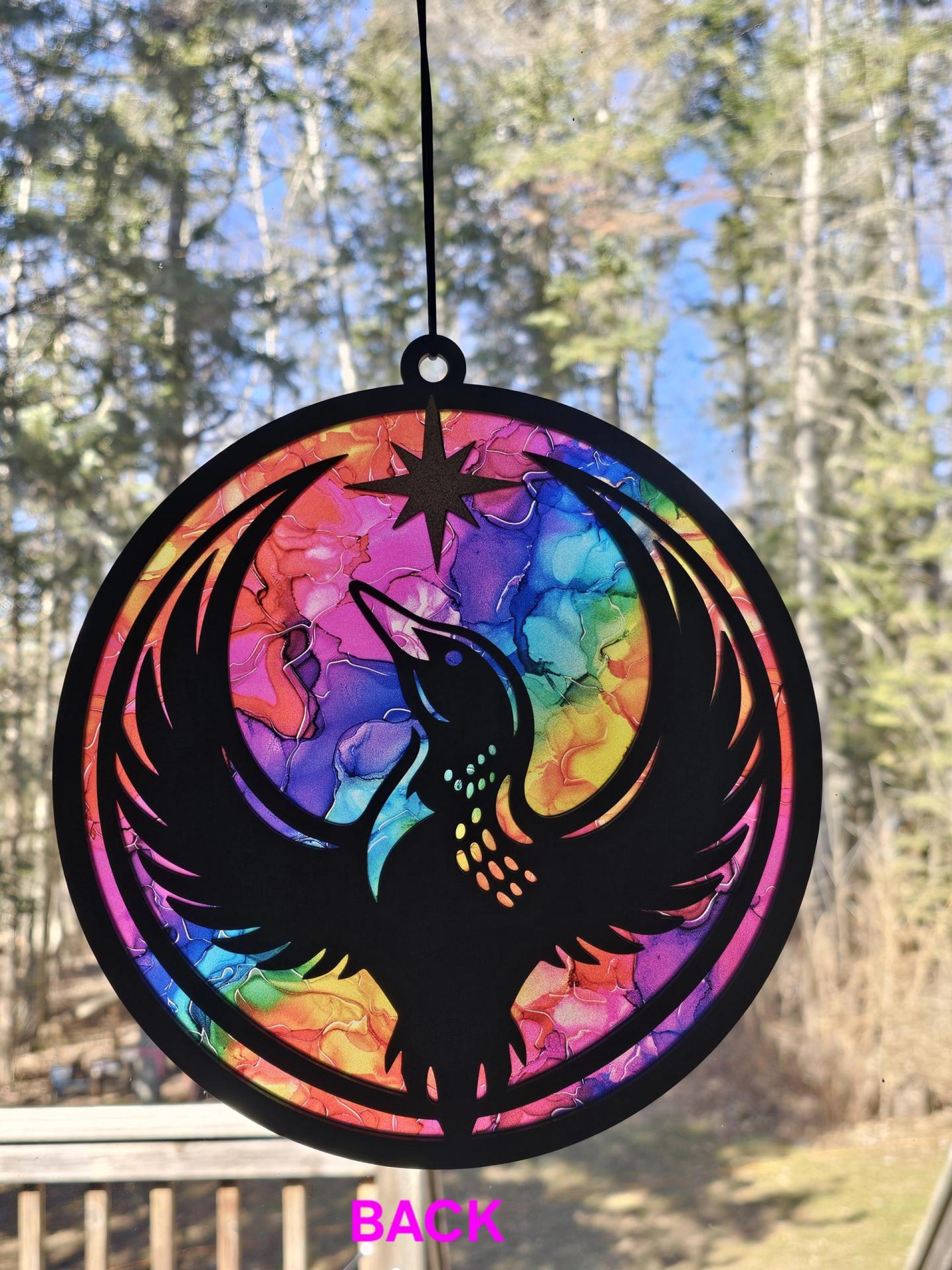 Back of Minnesota Rainbow Resistance Loon, Minnesota artist, suncatcher, translucent, northern lights. Made by Betsy Skagen of Blue Waters Studio & Emporium. Made in Minnesota.