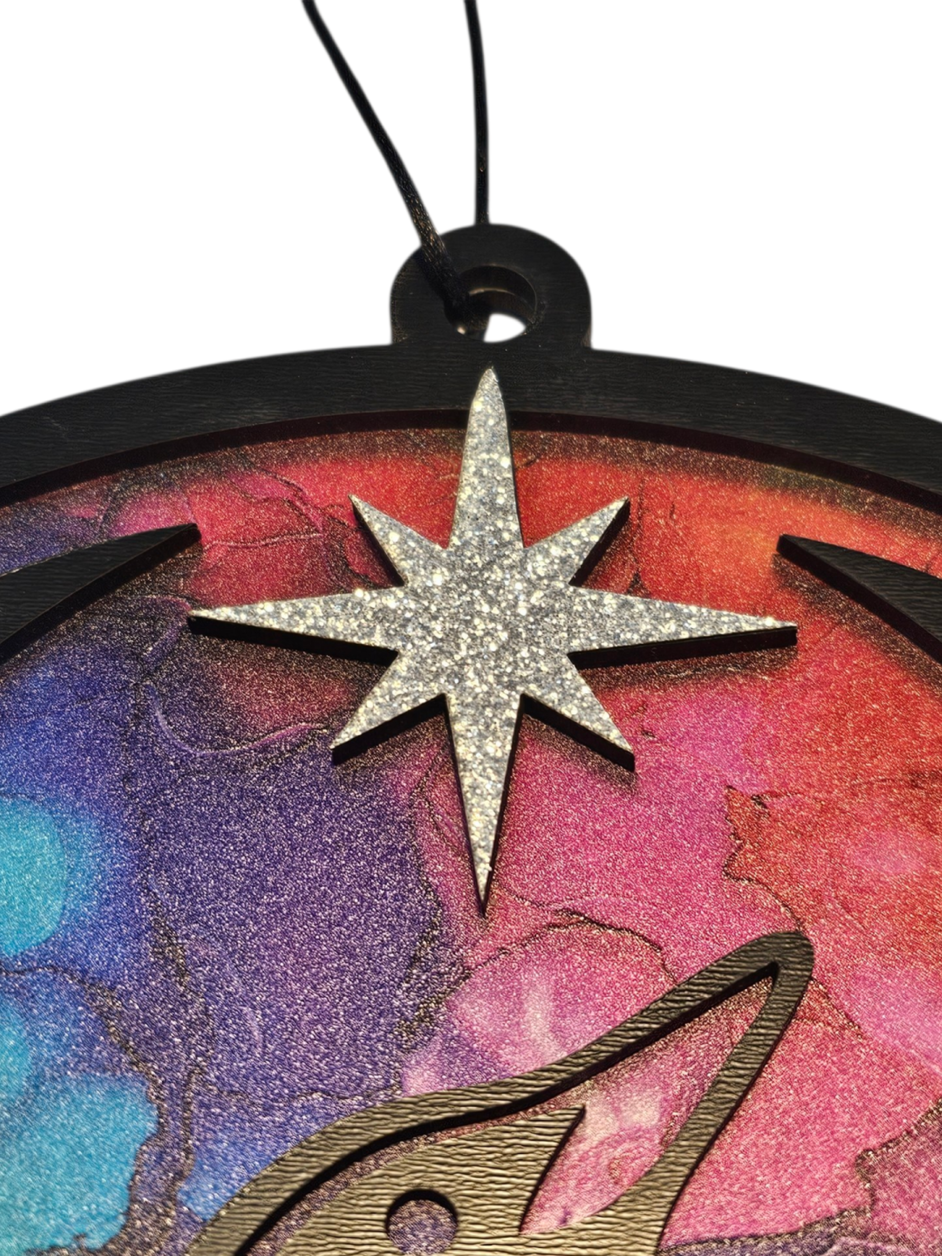 Glittery silver star. Minnesota Rainbow Resistance Loon, Minnesota artist, suncatcher, translucent, northern lights. Made by Betsy Skagen of Blue Waters Studio & Emporium. Made in Minnesota.