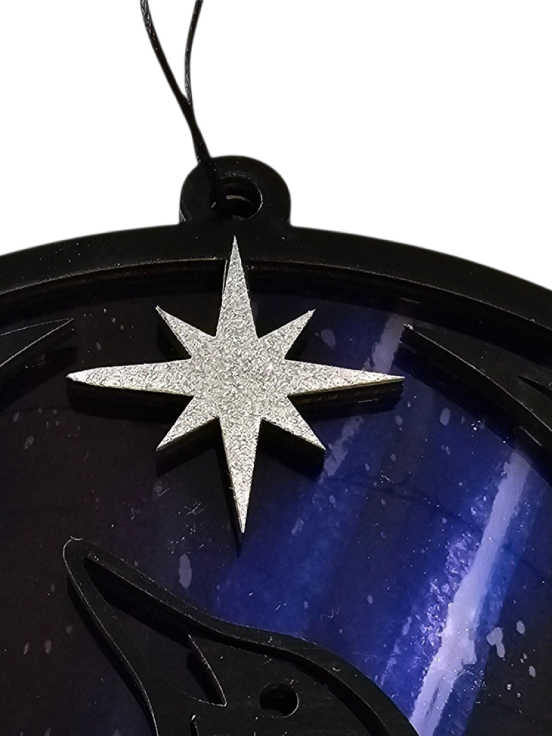 Glittery star for Minnesota Resistance Loon, Minnesota artist, suncatcher, translucent, northern lights. Made by Betsy Skagen of Blue Waters Studio & Emporium. Made in Minnesota.